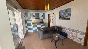a living room with a couch and a table at Shell's Apartment in Praia do Carvoeiro