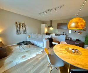 a living room with a couch and a table at Das Haus am Weinberg in Ensch