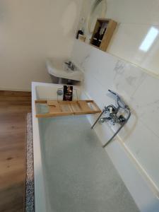 a small bathroom with a sink and a sink at Le Cocon in Cepoy
