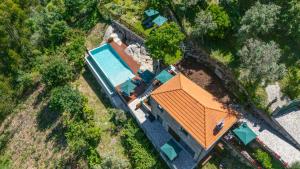 an overhead view of a house with an orange roof at ALDEIA DA MARGARIDA in Tarouquela