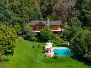 an aerial view of a house with a swimming pool at Rotui Luxury Village in San Martín de los Andes