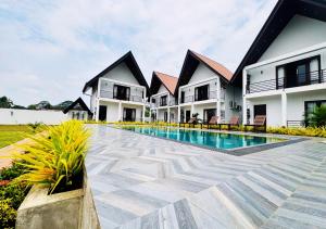 a view of the courtyard of a resort with a swimming pool at Gagana Resort in Anuradhapura