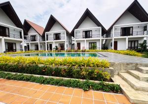 a view of the courtyard of a resort with a swimming pool at Gagana Resort in Anuradhapura
