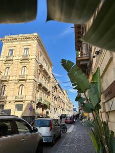 a city street with cars parked on the street at Ma Maison Etnea in Catania