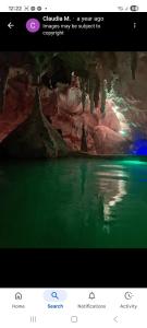 a computer screen with a picture of a cave with water at Kupe Retreat free wifi free parking two rooms ensuite bathroom for both in Whitianga