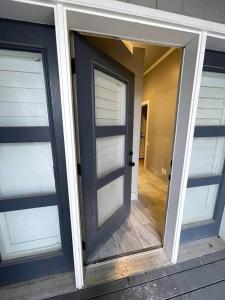 an open garage door with two windows on a house at Lehi East Bench Private Apt! in Lehi