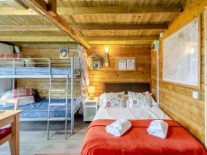 a bedroom with a bed and two bunk beds at Starling Lodge - Uk31071 in Westward +8 photos
