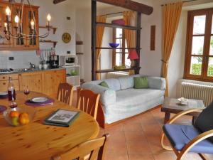 a living room with a table and a couch at Barolo in Gravedona
