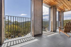 a balcony with a view of the mountains at Nelse Lodge in Falls Creek