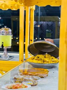 a table with two bowls of food on a table at Elite Rum Camp in Disah +44 photos