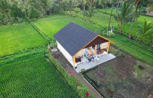 an overhead view of a house with a solar roof at Green House Tetebatu in Tetebatu