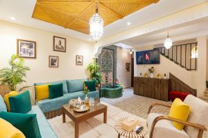 a living room with a couch and a table at Riad Dar Lamia Marrakech Médina in Marrakesh