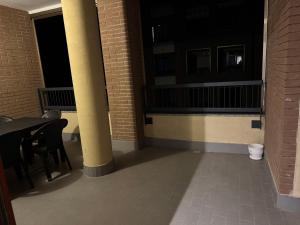 a room with a table and chairs and a balcony at Karen Sofia Modern Appartament in Opera