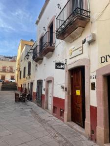 an empty street in a city with a building at Hotel Santo Domingo in Zacatecas
