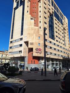 a large building with a mural on the side of it at Paradis résidence473 in Oran