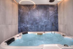a jacuzzi tub in a bathroom with at Nof Yareach - נוף ירח in Safed
