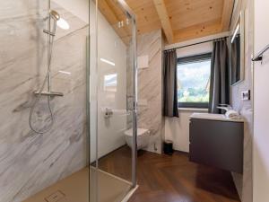 a bathroom with a shower and a toilet at Obermöschach 10 in Obermöschach +86 photos