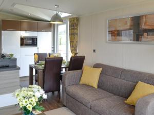 a living room with a couch and a table at Skylark Lodge in Westward