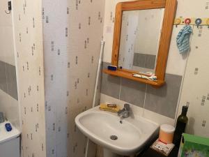a bathroom with a sink and a mirror at Lux 1 in Orléans