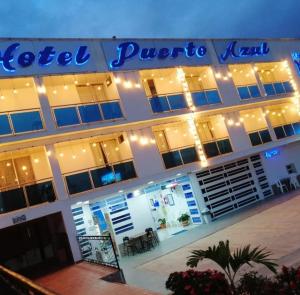 a hotel with a sign on the front of it at Hotel Puerto azul in Chitaraque