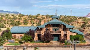 a house in the middle of a mountain at Cougar Ridge Resort in Torrey