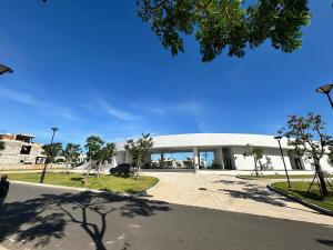 a building with a car parked in front of it at Aurora Golf Villa in Bình Sum