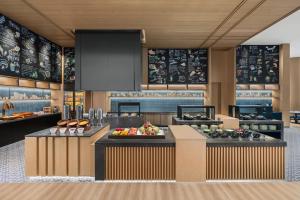 a kitchen with a counter with fruits and vegetables at Fairfield by Marriott Deqing in Huzhou