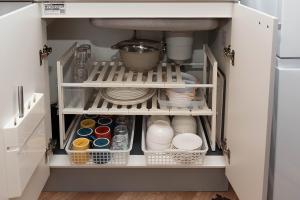 a cabinet filled with dishes and plates in a kitchen at Oyadoya江南名古屋まで車で40分Free car space2台 in Kōnan +36 photos