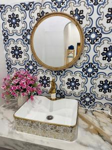 a bathroom with a sink and a mirror at Homestay Đan Sam in Ninh Hải +27 photos