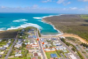 an aerial view of a town next to the ocean at Waves Luxury Suites & Port Central Apartments in Port Campbell