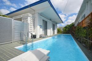 a swimming pool in the backyard of a house at Machinaka Miyako in Miyako-jima