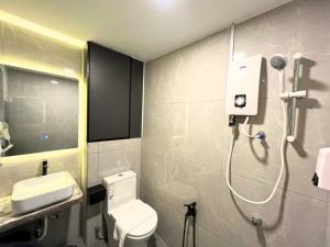 a bathroom with a toilet and a shower in it at Seeds Hotel Bukit Bintang in Kuala Lumpur +37 photos
