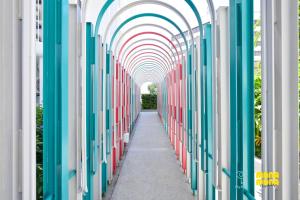 a hallway with an archway in a building at Stallionz by MyKey in Ipoh