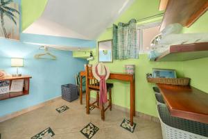 a room with a bunk bed and a desk at Casa Cielo Studio 1 with Tropical Garden Patio in Isla Mujeres