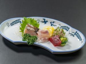 a plate of food with meat and vegetables on it at Lectore Atami Koarashi - TKP Hotels & Resorts in Atami