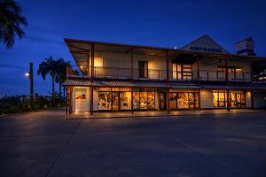 a large building with a lot of windows at night at Guest Space Fiji - Port Denarau Apts in Denarau