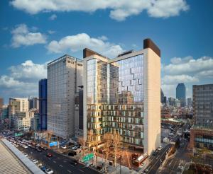 a rendering of a tall building in a city at 마티네차움호텔 in Seoul +5 photos