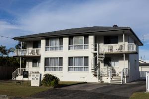 a white building with balconies and stairs on it at 2-45 Beech Street in Evans Head