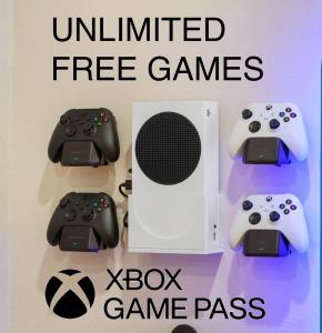 two video game controllers and a xbox game pass at Galaxy Quest by OC Adventure Homes in Garden Grove +54 photos