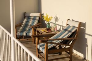 two chairs and a table on a balcony at 4-45 Beech Street in Evans Head