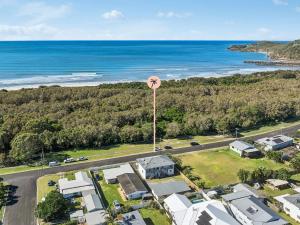 an aerial view of a neighbourhood with a pink water tower at 1-45 Beech Street in Evans Head