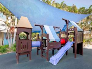a group of playground equipment in a yard at BreakFree Diamond Beach in Gold Coast