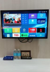 a flat screen tv hanging on a wall at BOOKME HOTEL in Johor Bahru