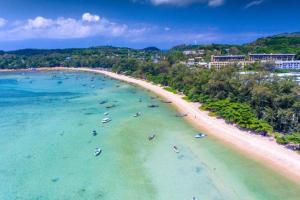 an aerial view of a beach with people in the water at 3 BR Pool Villa Lancelot in Rawai in Ban Saiyuan (1)