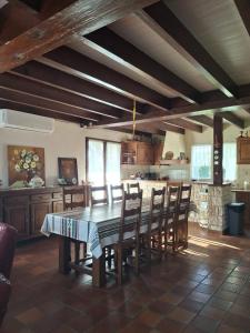 a kitchen with a table and chairs in a room at Maison familiale Pays Basque in Ahaxe-Alciette-Bascassan