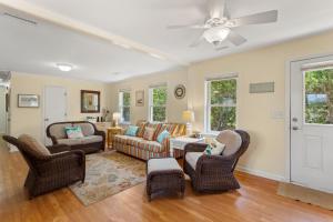 a living room with furniture and a ceiling fan at 2010 - Just Ducky in Sanderling