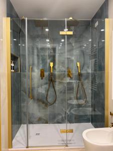 a shower with a glass door in a bathroom at Maison ì room, suite & apartment in Reggio di Calabria +55 photos