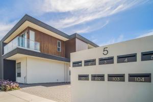 a rendering of a house with the number at Chic Flinders Park Getaway in Adelaide