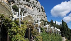 a building with a mountain in the background at le Cocon du Causse in Causse-de-la-Selle