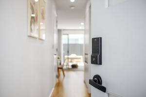 a view of a hallway with a living room at Chic Flinders Park Getaway in Adelaide